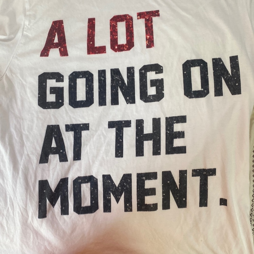 Taylor Swift “a lot going on at the moment” Red Era Tee + Heart Sunglasses